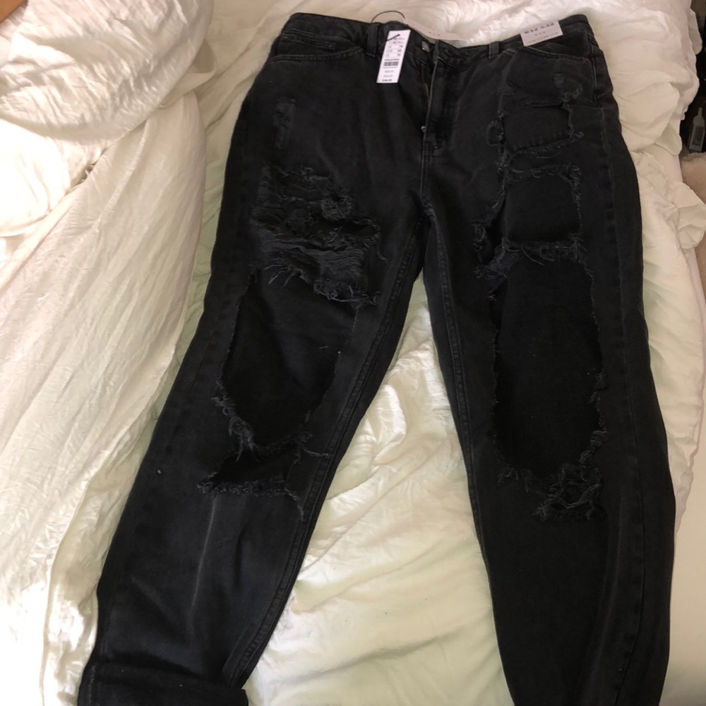 Never worn black super ripped top shop jeans